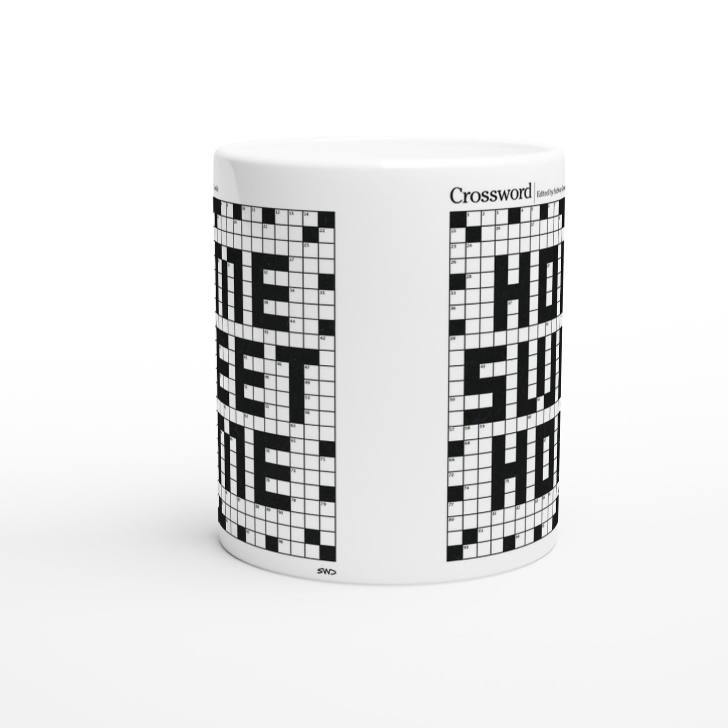 Side view of a white mug with a crossword puzzle graphic that reads HOME SWEET HOME.
