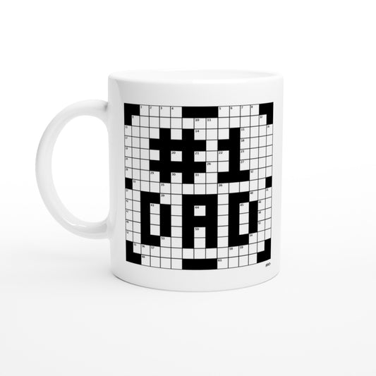 A white coffee mug with a crossword themed graphic that reads #1 DAD.