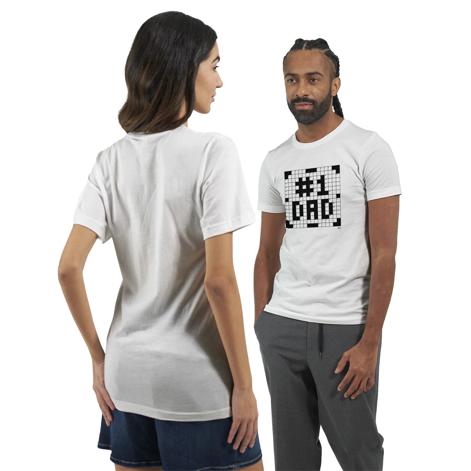 A man and woman model white t-shirts with a crossword themed graphic that reads #1 DAD.